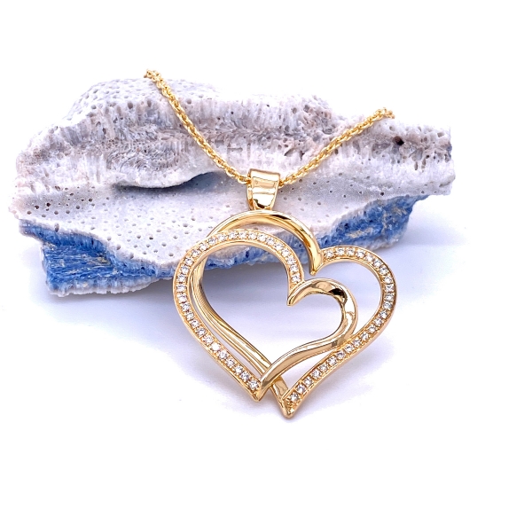 Double heart pendant in yellow gold with diamonds